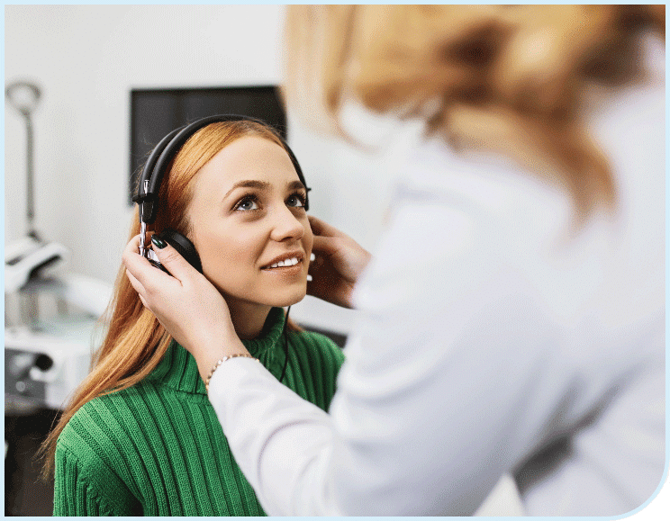 Woman getting her hearing tested by her audiology